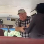 unidentified white Georgia school bus driver allegedly pushing two Black students