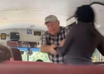 unidentified white Georgia school bus driver allegedly pushing two Black students