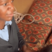 African woman member non-governmental organization NGO Mwai clients' hair blind